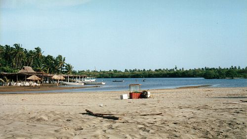Enramada restaurants fronting the lagoon at Barra de Potos&iacute;, Guerrero, Mexico